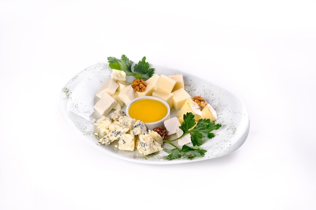 cheese plate with honey on a white isolated background.