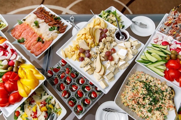 Cheese plate with other snacks on a banquet table