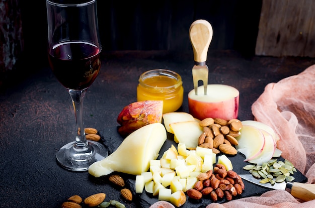 Cheese platter and glass of red wine