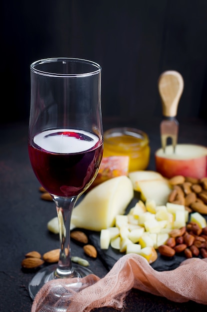 Cheese platter and glass of red wine