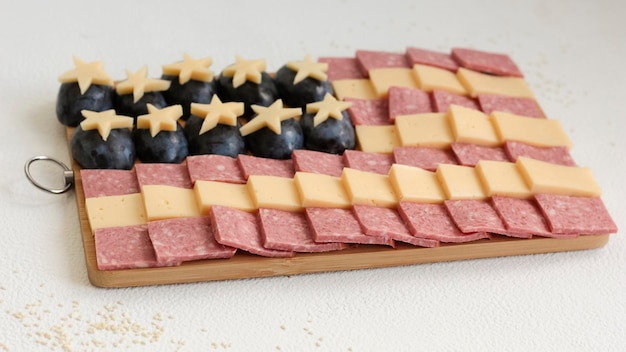 Cheese and sausage sliced for America's Day neatly laid out in the form of a flag