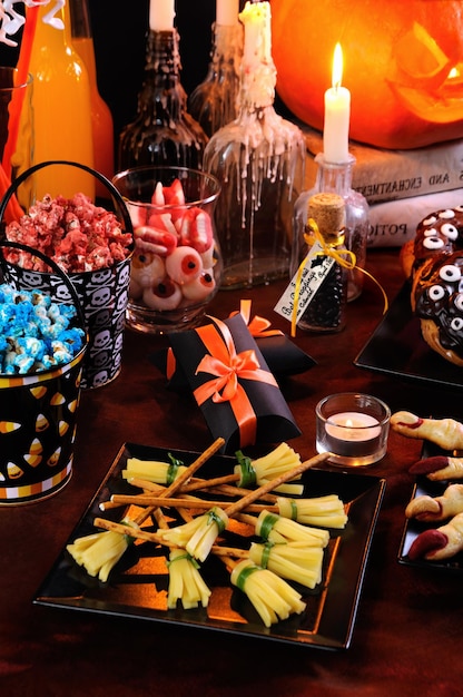 Cheese snack in the form of a witch broom Great idea of serving at a buffet table of Halloween