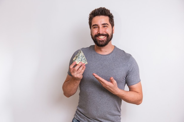 Cheese taster man holding a piece of gorgonzola on white background.