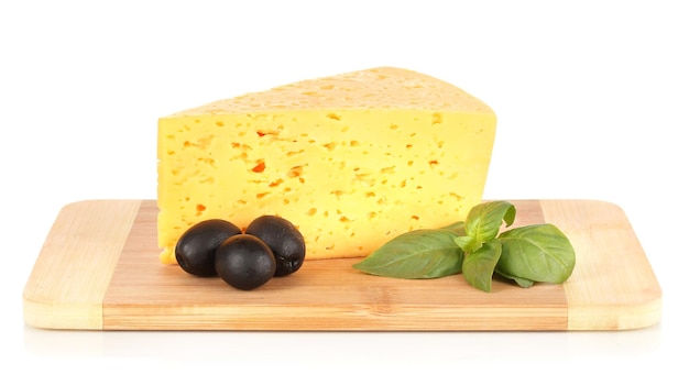 Cheesebasil and black olives on cutting board isolated on white