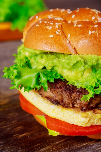 Cheeseburger macro with wood background and selective focus