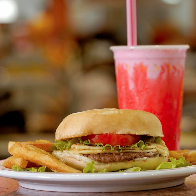 Cheeseburger sandwich with strawberry milkshake