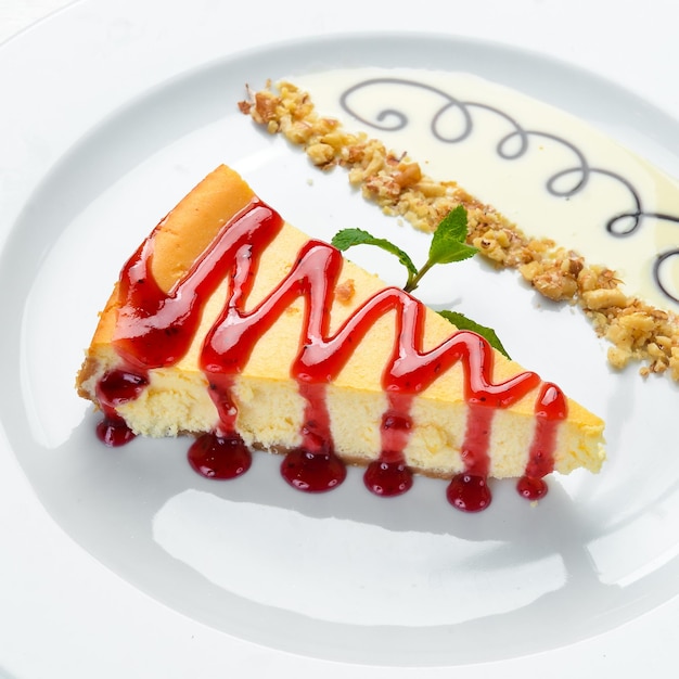 Cheesecake with berry jam and mint. Top view. Free space for your text.