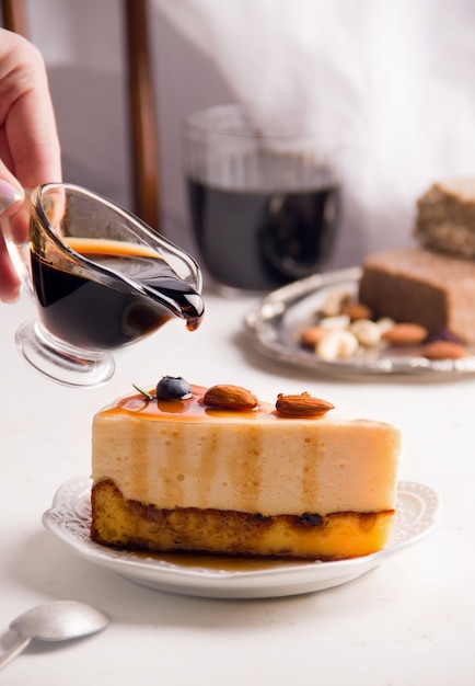 Cheesecake with caramel and nuts. Copy space. Vertical photo