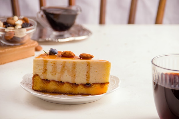 Cheesecake with nuts on a light background. Sweets