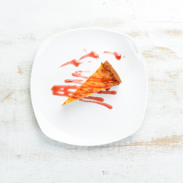 Cheesecake with strawberry sauce. Top view. Free space for your text.