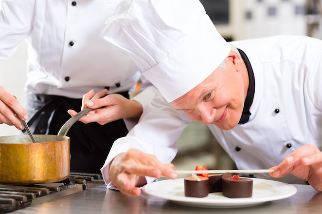 Chef as Patissier cooking in Restaurant dessert