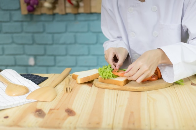 Chef cooking breakfast in kitchen