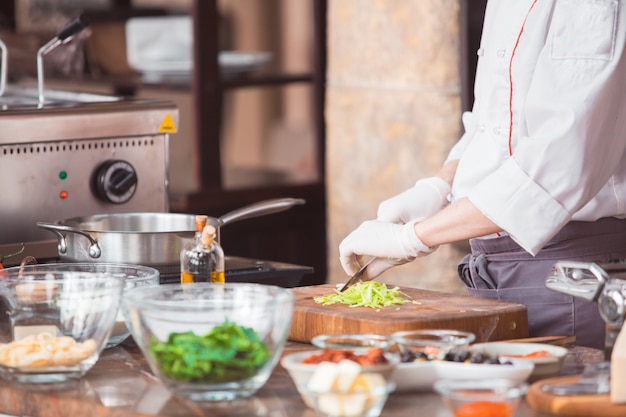 Chef cooks spaghetti in a premium restaurant.