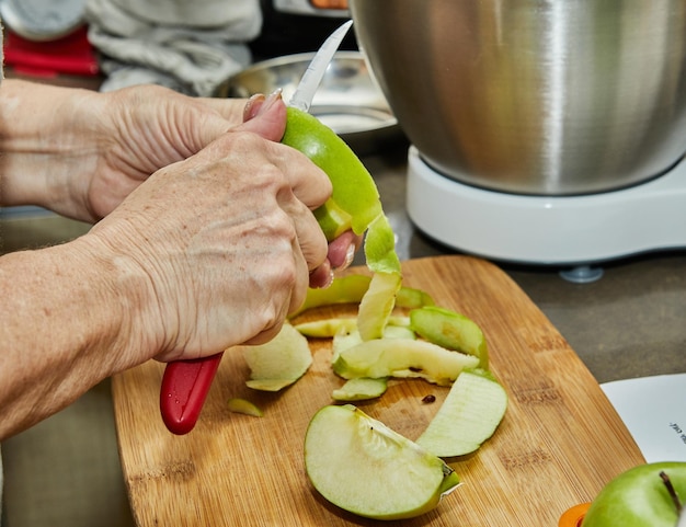 Chef cuts apples to make an apple pie Step by step recipe