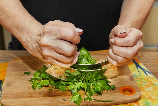 Chef grinds dill with special device that speeds up the work