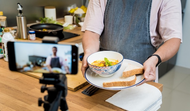 The chef is broadcasting live from workshop how to prepare a vegetarian food