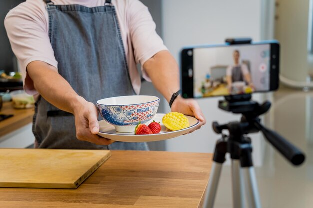 The chef is broadcasting live from workshop how to prepare a vegetarian food