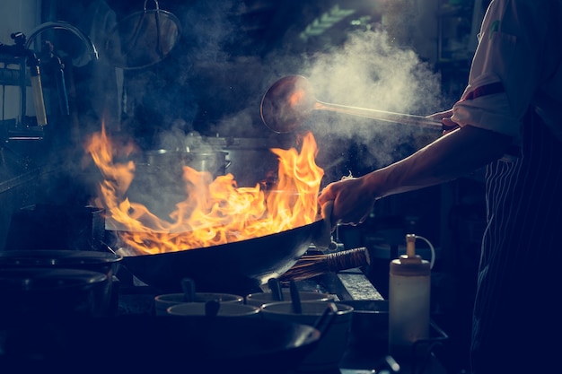 Chef is stirring vegetables