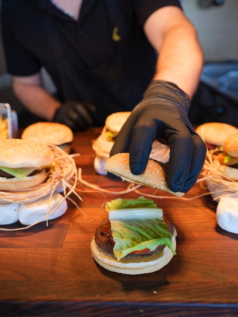 Chef in the kitchen preparing hamburger