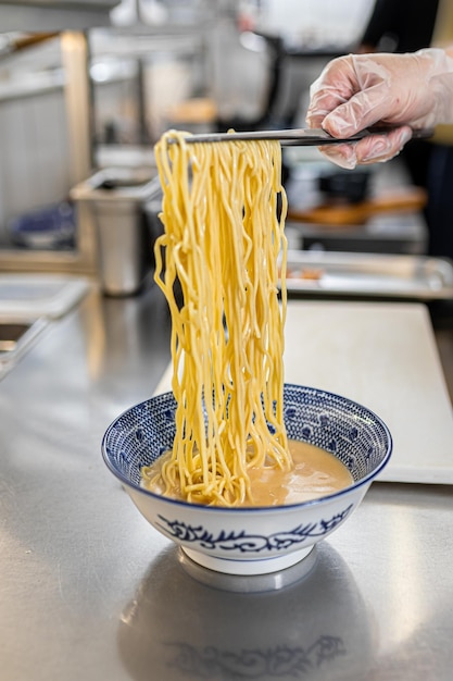 Chef making japanese ramen noodle soup