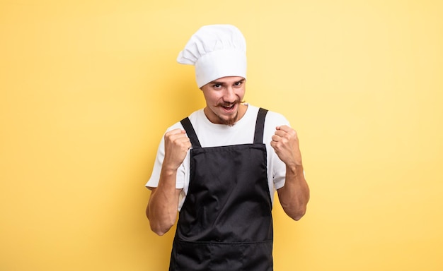 Chef man feeling shockedlaughing and celebrating success