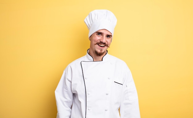 Chef man looking happy and pleasantly surprised