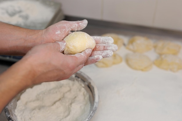 The chef prepares the dough for tortillas and burgers