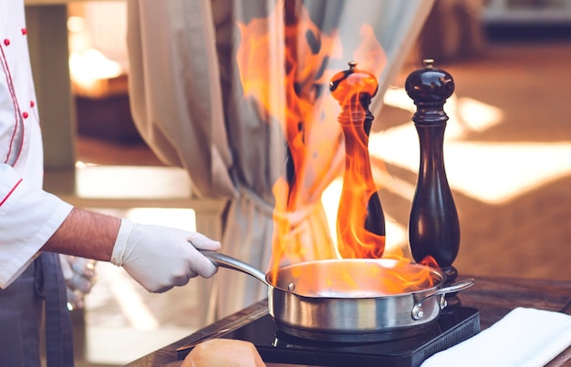 The chef prepares the Foie gras before the guests.