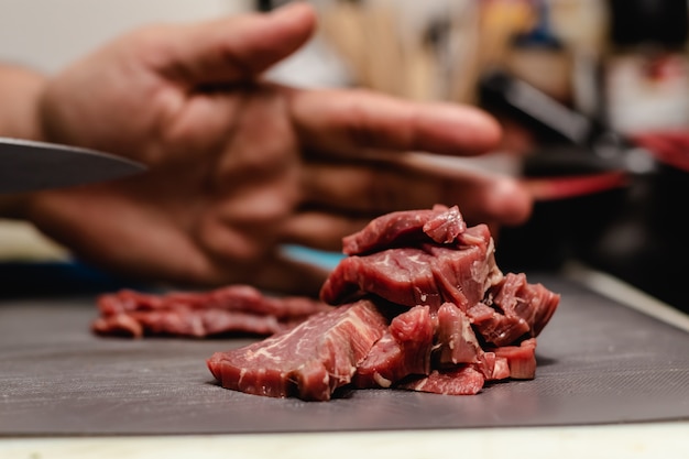 Chef preparing steak tartar of old cow sirloin with 40 days of maturation on restaurant