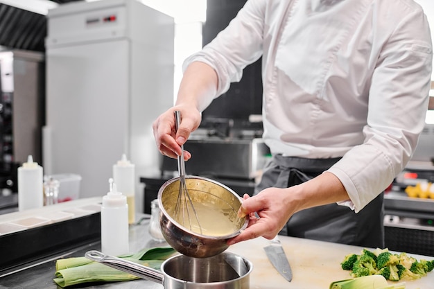 Chef wipping cream for cake