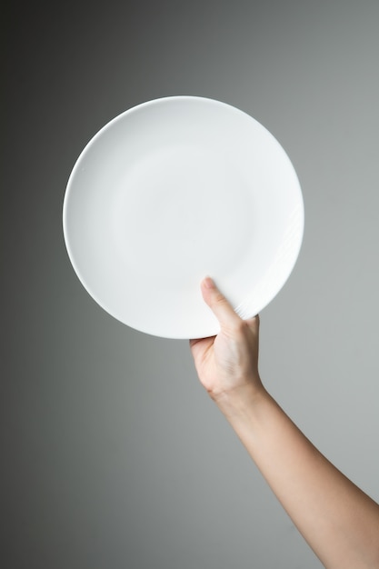 Chef with white empty plate 