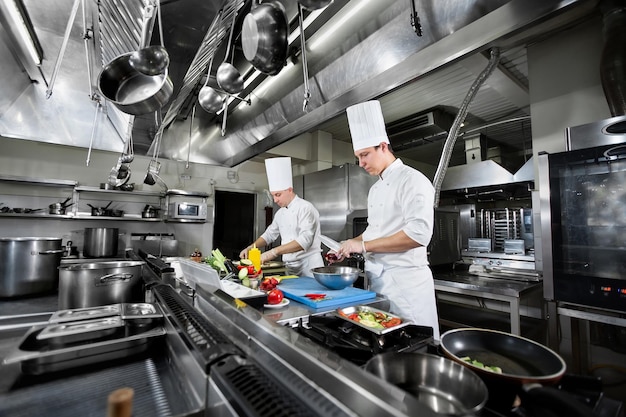 Chefs prepare meals in the kitchen