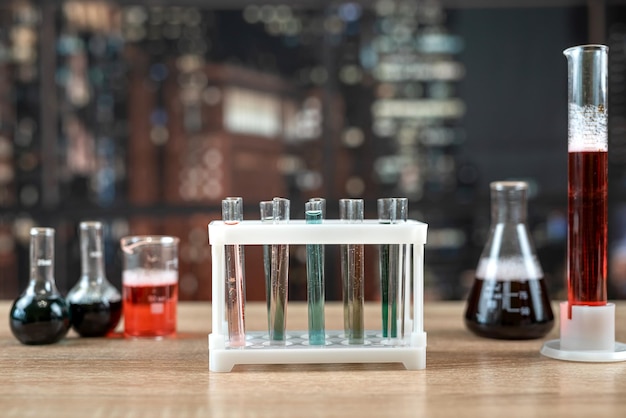 Chemical flasks with colorful liquids on laboratory desk