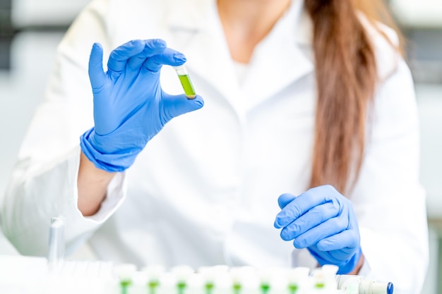 Chemical sample in the hand of a scientist in a research laboratory