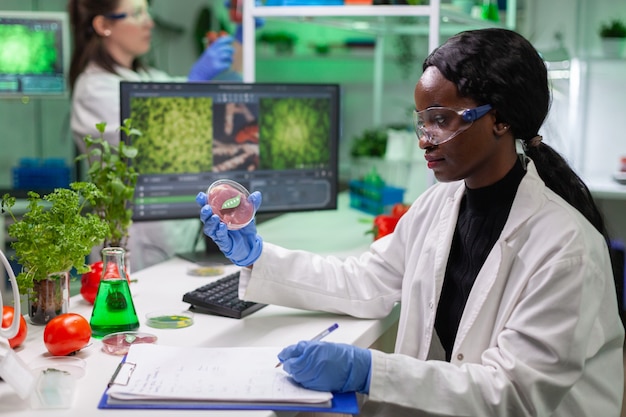 chemist woman analyzing vegan beef meat for biochemistry experiment