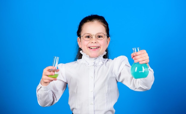 Chemistry fun Basic knowledge Knowledge day Schoolgirl with chemical liquids Childhood and upbringing Knowledge and information Experimenting a bit Small kid study Education concept