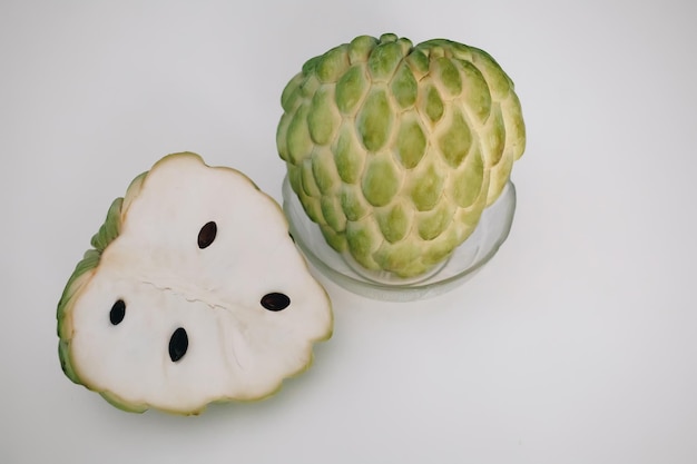 Cherimoya sugar apple eshta fruit cut with black seeds exotic sweet food in egypt