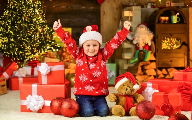 Cherished dreams. Happy childhood. Winter holidays. Playful baby boy. Happy child celebrate new year. Little boy play near christmas tree. Christmas eve. Kid fun home. Merry christmas everyone.