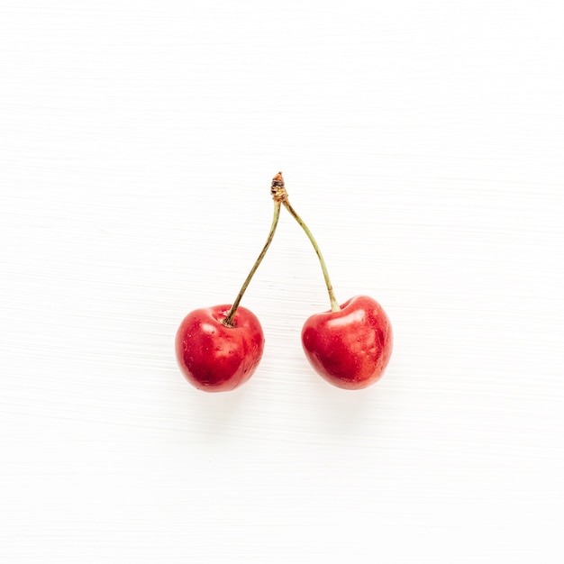 Cherries branch isolated on white surface