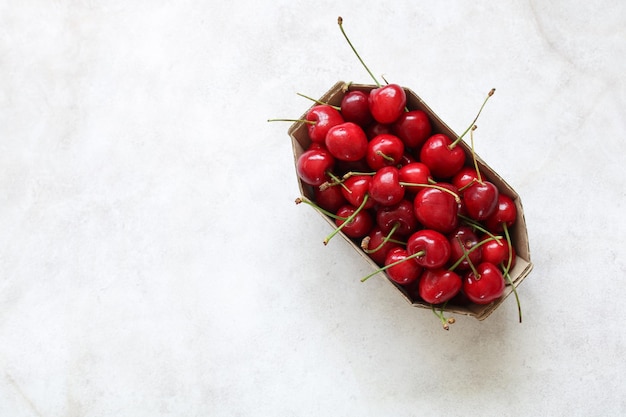 Cherries in a cardboard tray top view