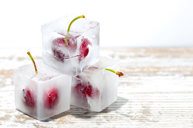 Cherries inside ice cubes