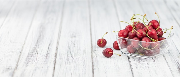 Cherries on wooden background selective focus