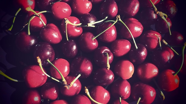 Cherry background Juicy ripe delicious cherry or sweet cherry closeup from above Summer fruits and berries Vitamin Diet