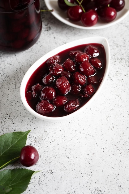 Cherry jam and fresh cherries in a bowl homemade preserves