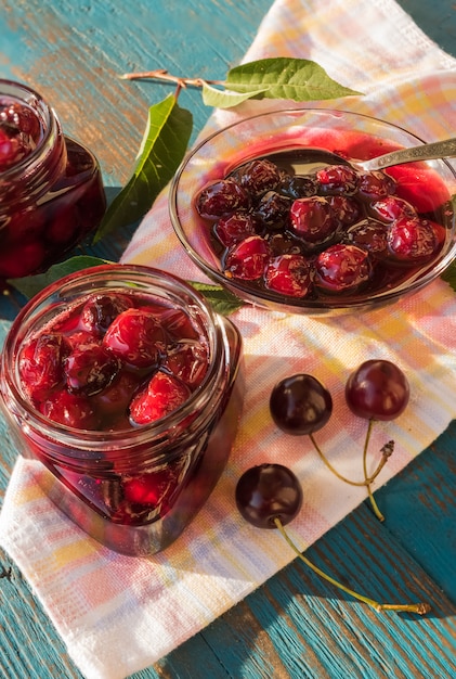 Cherry jam in glass jars.