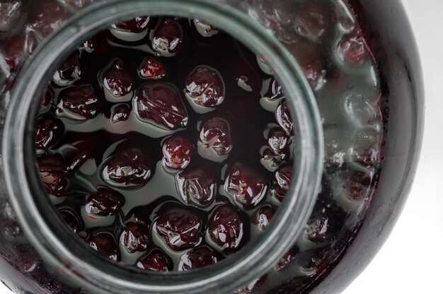 Cherry jam is in the jar