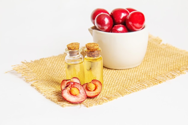 Cherry oil in a small jar selective focus nature