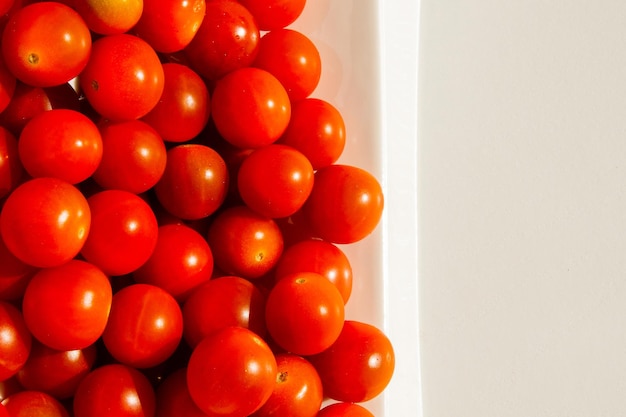 Cherry tomatoes Cherry tomatoes in a white plate Hard light Bright light and shadow