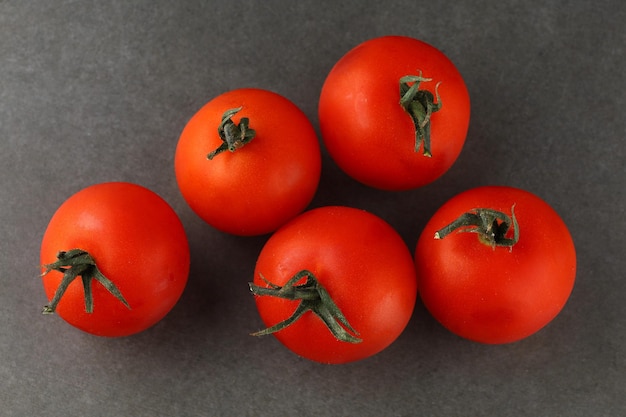 Cherry tomatoes on a dark background