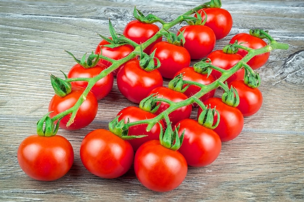 Cherry tomatoes on grey background